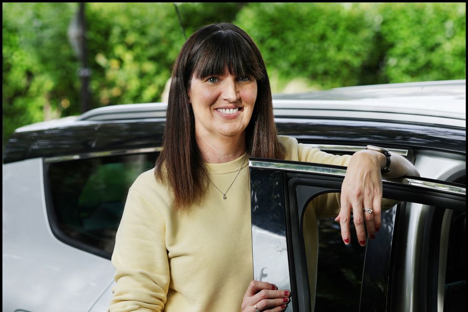 Melanie Finn back home with her car after it was hit by mechanical problems at the start of a family holiday to France. Photo: Steve Humphreys